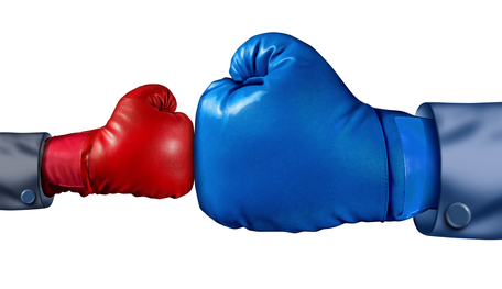 blue boxer glove and red boxing glove touching