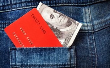 jeans with money and credit card sticking out
