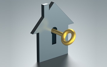 cutout of house with key in it keyhole